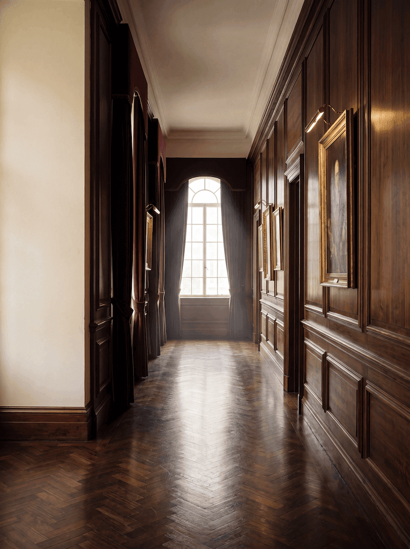 A quiet, considered office interior with warm natural daylight